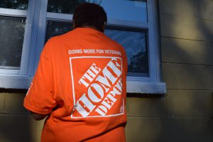 Home Depot volunteer working on a Preservation and Repair Project