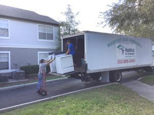 ReStore staff loading/unloading donations