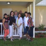 The Villages Home Decorating Club outside the Fruitland Park Habitat Lake-Sumter house with homeowner