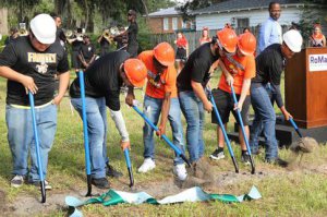 Leesburg High students put the shovels in the ground during groundbreaking ceremony for a joint project of Habitat for Humanity and Leesburg High School’s Construction Academy on Monday, Aug. 26, 2019. Students will work alongside professionals to build a home for a family in need on 12th Street in Leesburg. (Rosemarie Dowell/Orlando Sentinel)