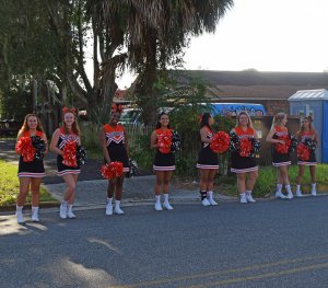 Leesburg High School cheerleaders welcoming guests