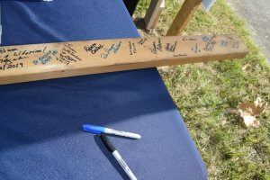 2x4 board signed by guests at ground breaking
