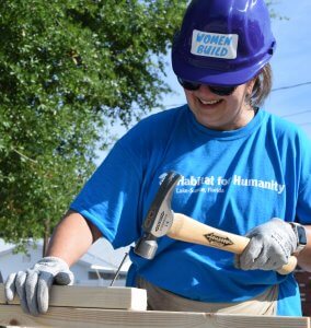 Eustis Site Women Build 2019 - smiling and hammering