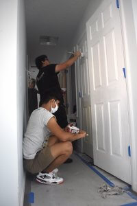 Leesburg High School students painting interior