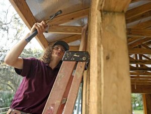 Braden Brown, a senior in the of The Villages High School Construction Academy, helps build a Habitat for Humanity home in Wildwood. George Horsford, Daily Sun