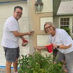 2 volunteers painting at Veterans Day project 2021
