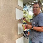 volunteer painting 2 at Veterans Day project 2021
