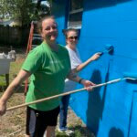 publix volunteers painting with rollers 2022
