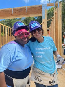 smiling volunteers on women build site 2022